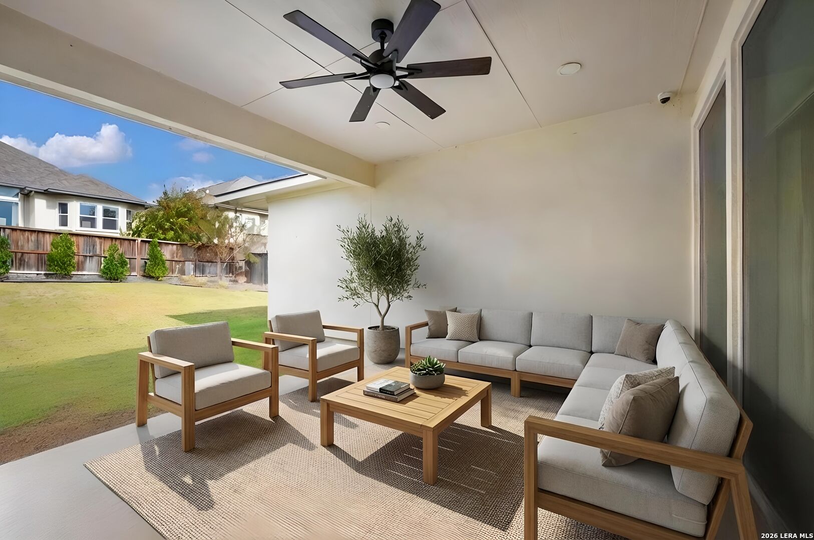 8527 Nichols Rim Boerne, TX 78015 - Photo 31 of 33 a living room with furniture and a large window with garden view
