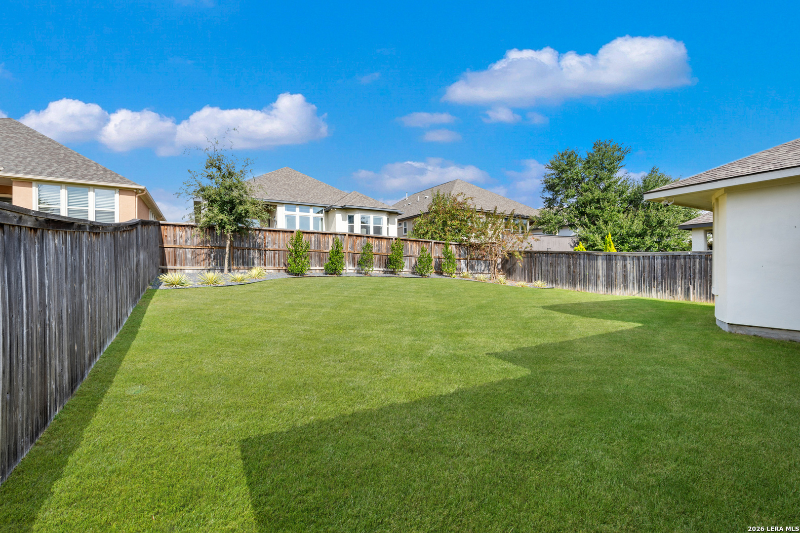 8527 Nichols Rim Boerne, TX 78015 - Photo 33 of 33 a view of a backyard with a garden and plants
