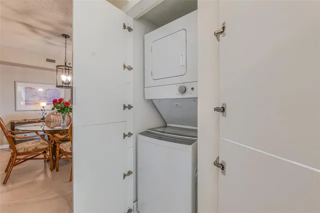 a view of a hallway with paintings on the wall