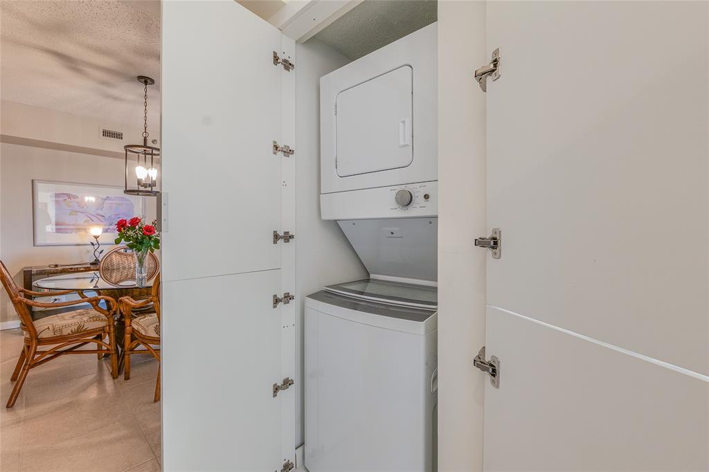 7200 Radice Court, Unit 705 Lauderhill, FL 33319 - Photo 11 of 54 a view of a hallway with paintings on the wall