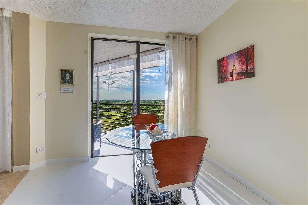 7200 Radice Court, Unit 705 Lauderhill, FL 33319 - Photo 15 of 54 a living room with furniture and a window