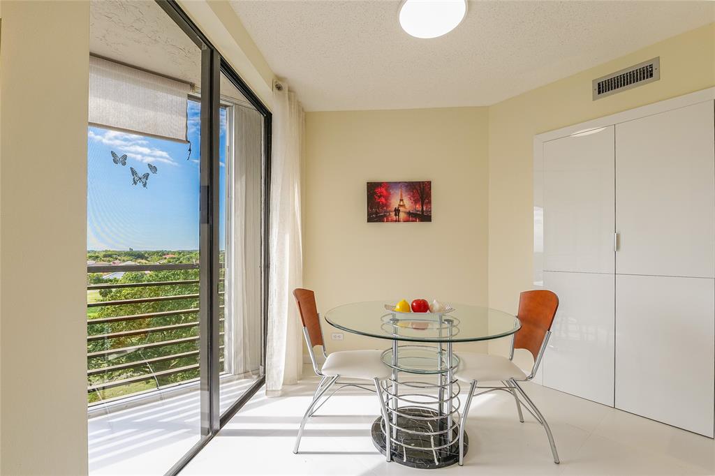 7200 Radice Court, Unit 705 Lauderhill, FL 33319 - Photo 17 of 54 a dining room with furniture and window
