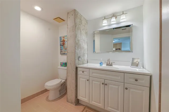 a bathroom with a shower sink and mirror