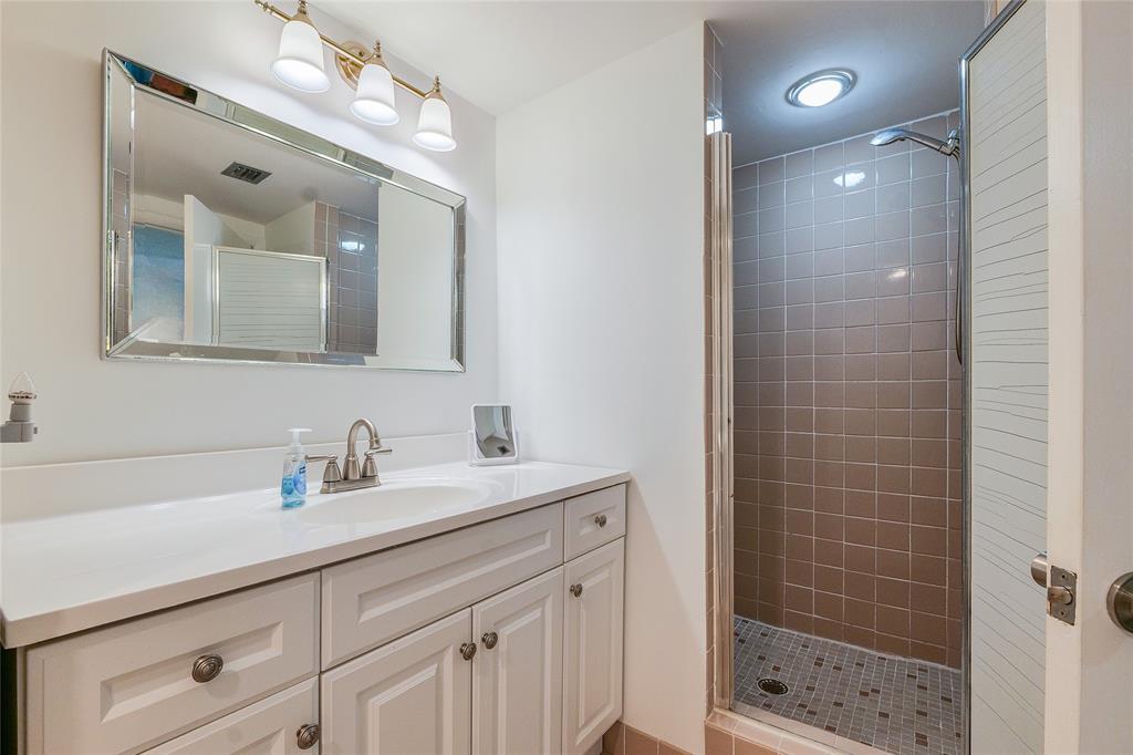 7200 Radice Court, Unit 705 Lauderhill, FL 33319 - Photo 19 of 54 a bathroom with a shower sink and mirror