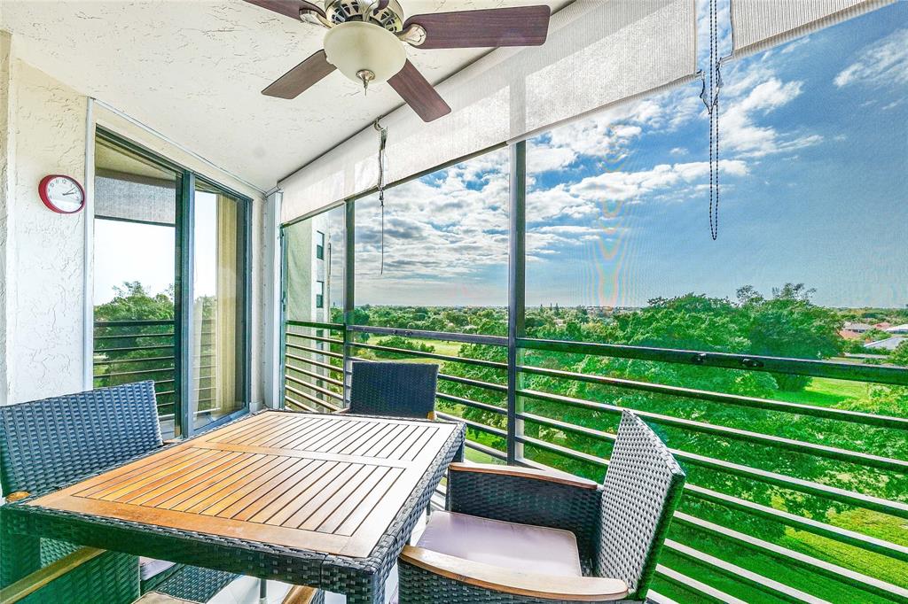7200 Radice Court, Unit 705 Lauderhill, FL 33319 - Photo 2 of 54 a view of a chairs and table in the balcony