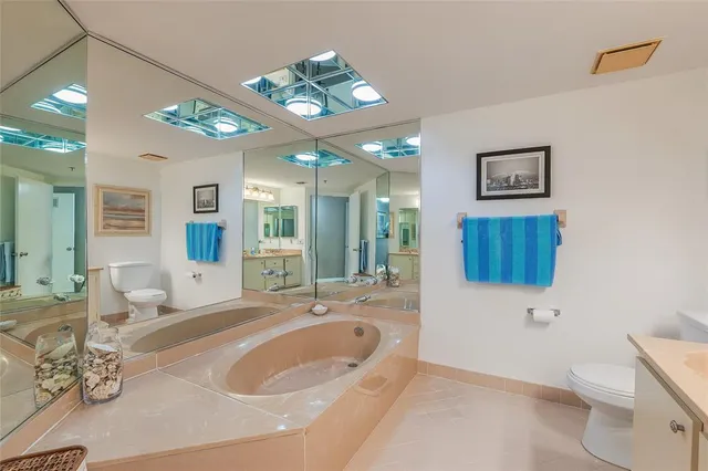a bathroom with a sink a vanity and a mirror