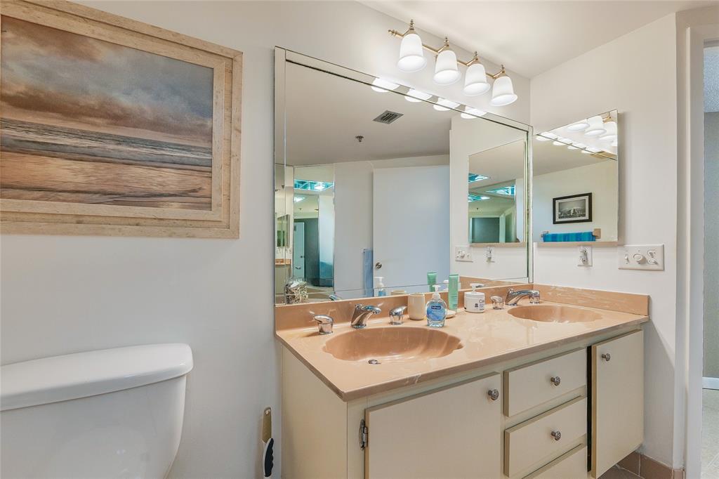 7200 Radice Court, Unit 705 Lauderhill, FL 33319 - Photo 22 of 54 a bathroom with a sink a vanity and a mirror