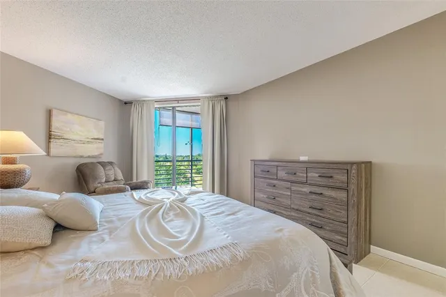 a bedroom with a bed and dresser