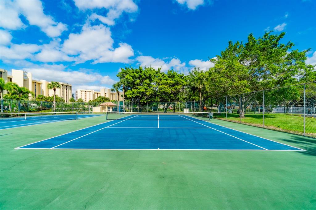 7200 Radice Court, Unit 705 Lauderhill, FL 33319 - Photo 32 of 54 a view of a tennis court