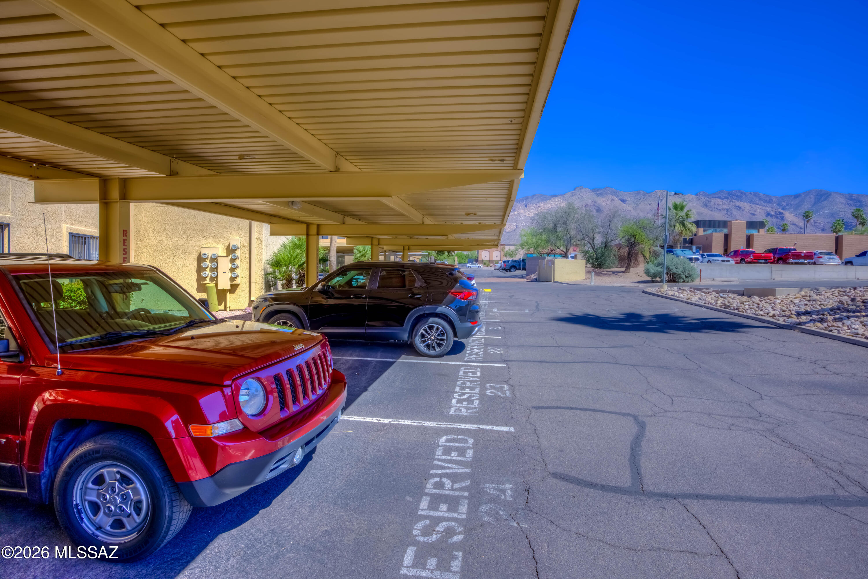 5500 North Valley View Road, Unit 123 Tucson, AZ 85718 - Photo 3 of 36 a front view of a house with parking space