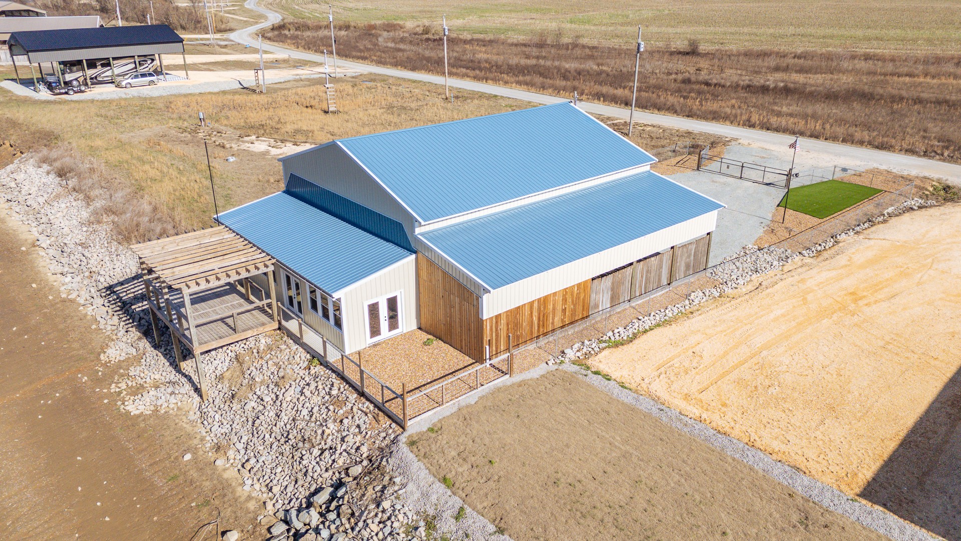 a view of a patio with lawn chairs