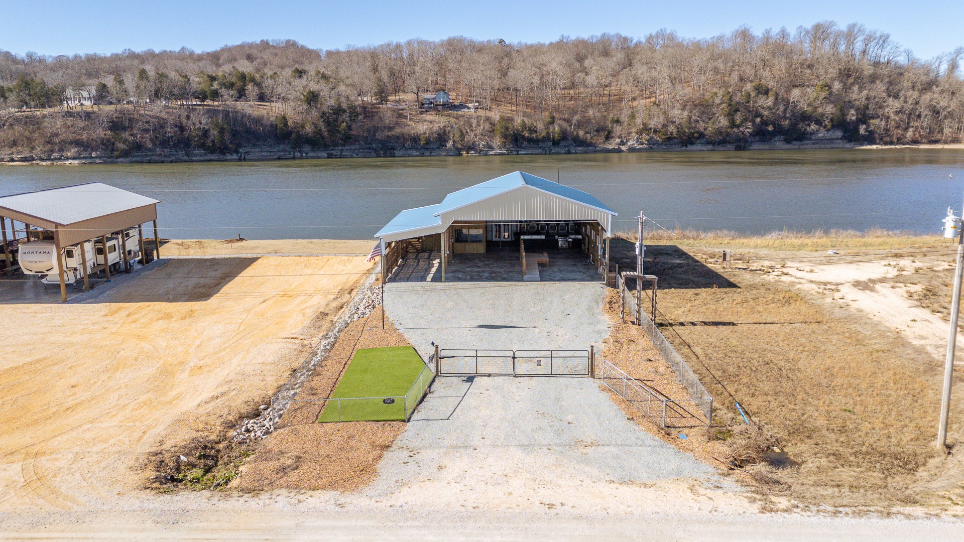 2217 Hardin Bottom River Road Clifton, TN 38425 - Photo 50 of 66 a view of a lake with a mountain in the background