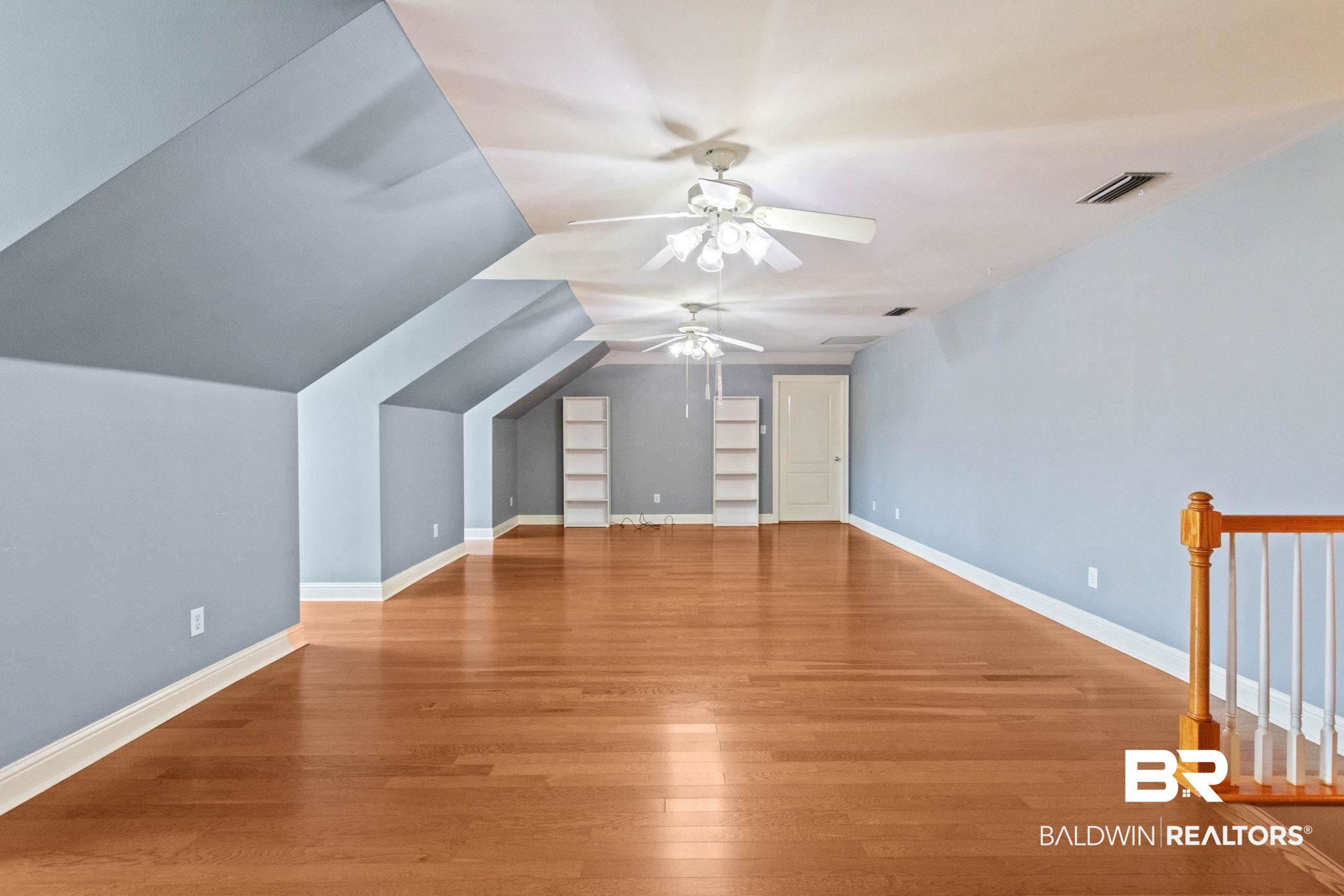3176 Cedar Court Mobile, AL 36619 - Photo 28 of 33 Expansive bonus room featuring wood-finish flooring, multiple ceiling fans, recessed lighting, and built-in shelving