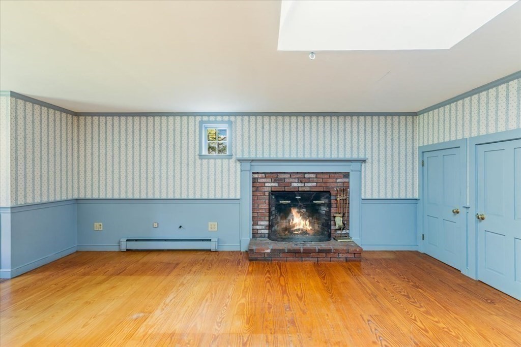 1 Robbins Path Carver, MA 02330 - Photo 17 of 42 a room with a fireplace and a fireplace