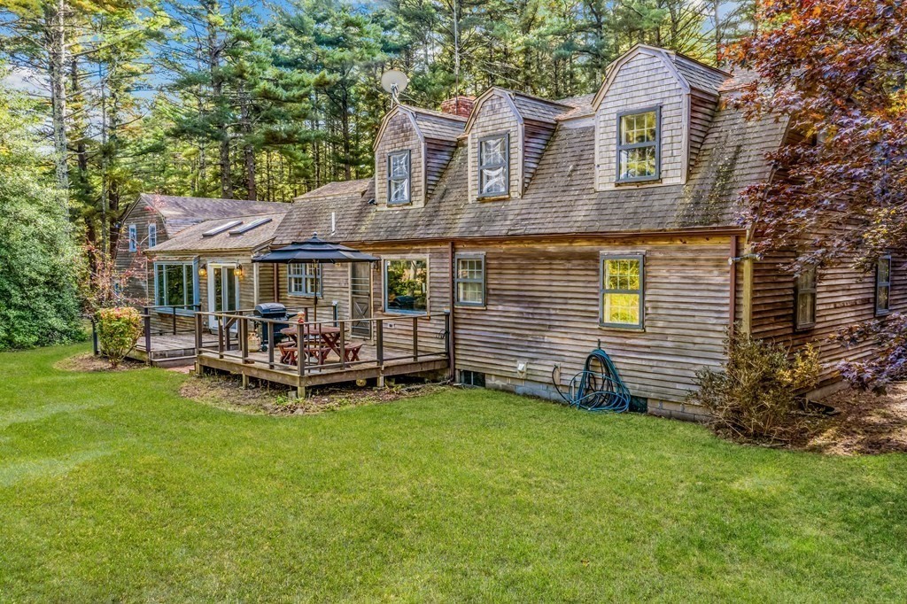 1 Robbins Path Carver, MA 02330 - Photo 21 of 42 a view of a house with a yard and sitting area