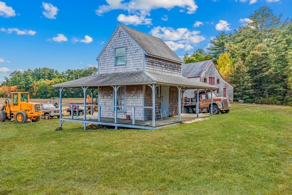 1 Robbins Path Carver, MA 02330 - Photo 22 of 42 a front view of a house with garden
