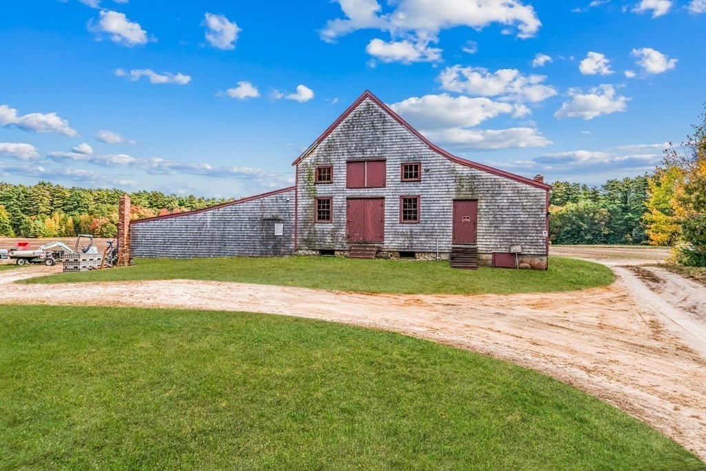 1 Robbins Path Carver, MA 02330 - Photo 23 of 42 a front view of house with yard and swimming pool