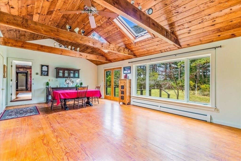 1 Robbins Path Carver, MA 02330 - Photo 6 of 42 a living room with stainless steel appliances kitchen island granite countertop furniture and a large window