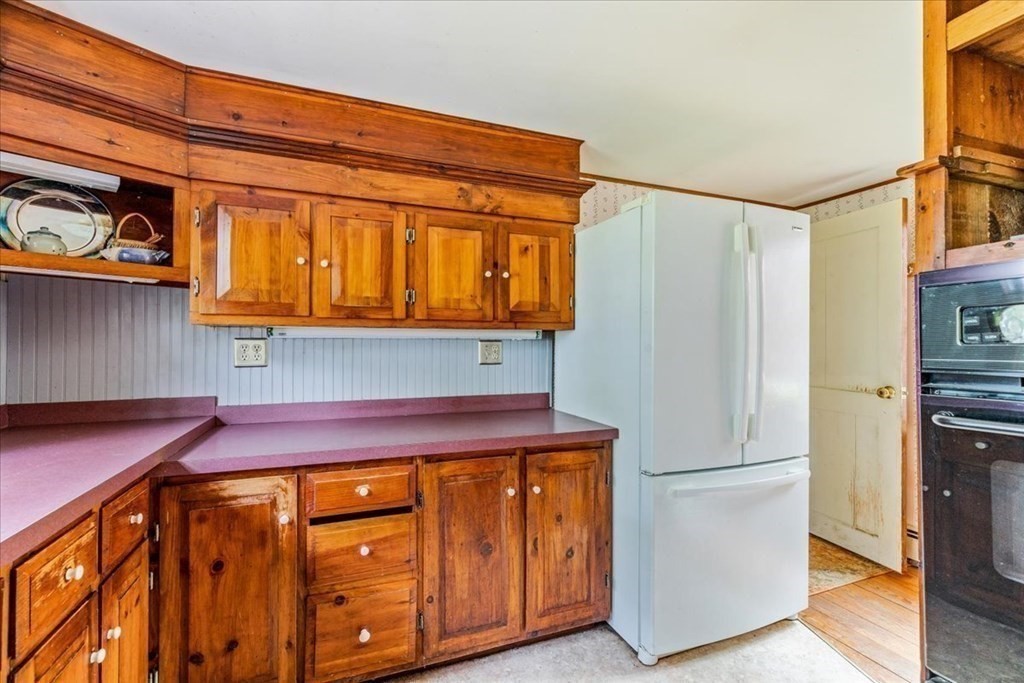 1 Robbins Path Carver, MA 02330 - Photo 8 of 42 a kitchen with stainless steel appliances granite countertop a refrigerator and a stove top oven