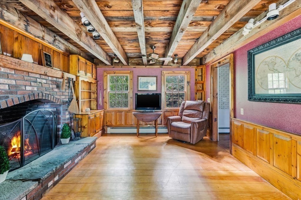 1 Robbins Path Carver, MA 02330 - Photo 10 of 42 a living room with furniture and a fireplace