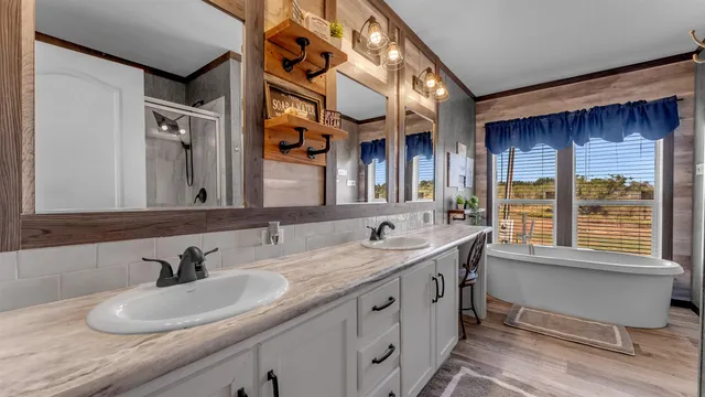 a bathroom with a double vanity sink and a mirror