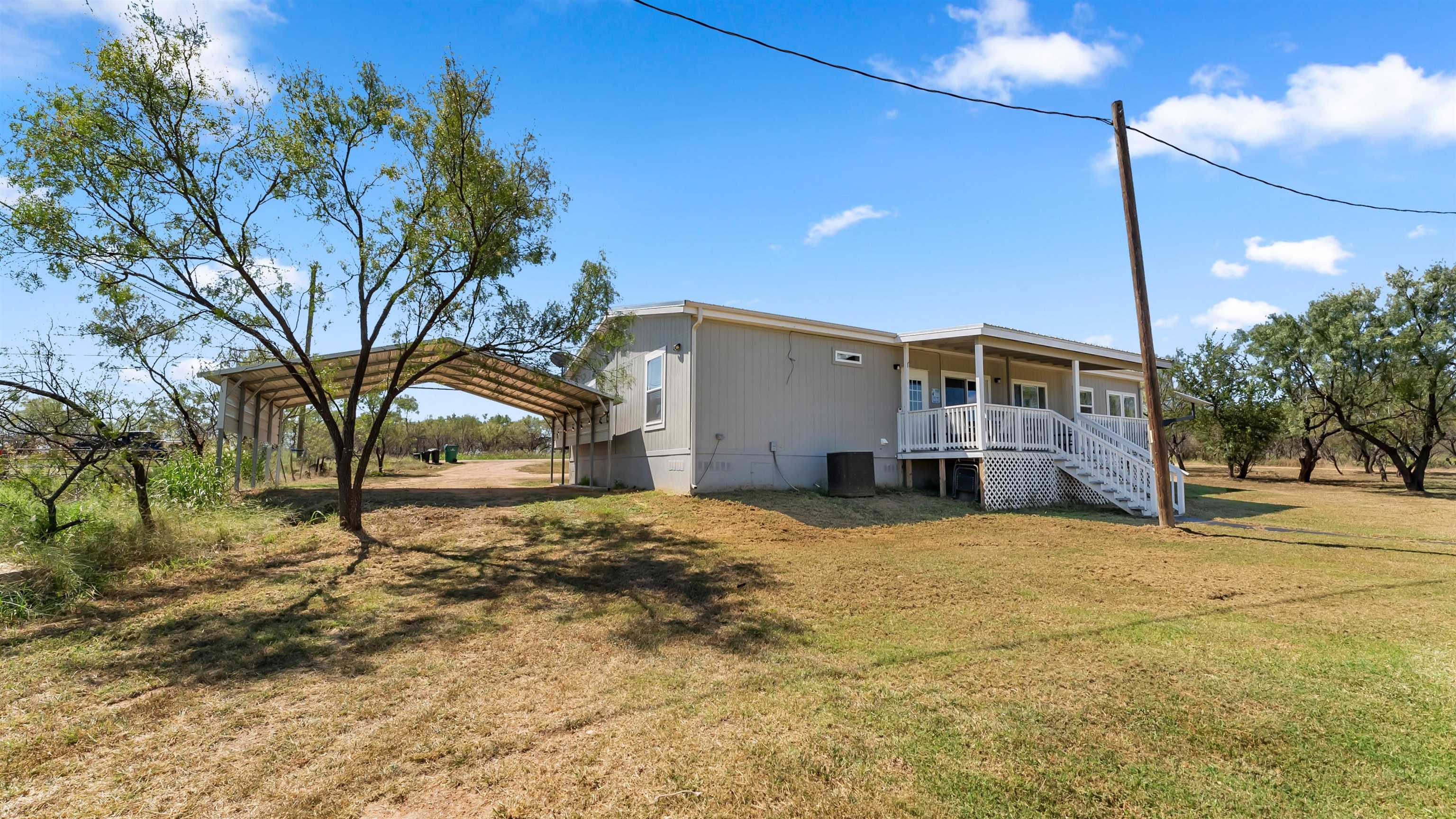 321 Flag Creek Ranch Circle Llano, TX 78643 - Photo 21 of 30 a view of a house with a yard