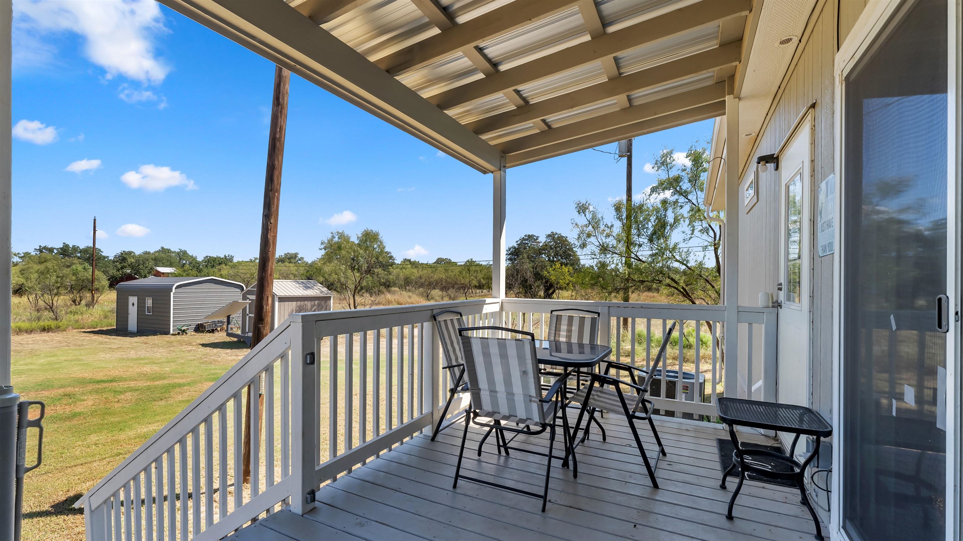 321 Flag Creek Ranch Circle Llano, TX 78643 - Photo 22 of 30 a view of a chairs on the roof deck