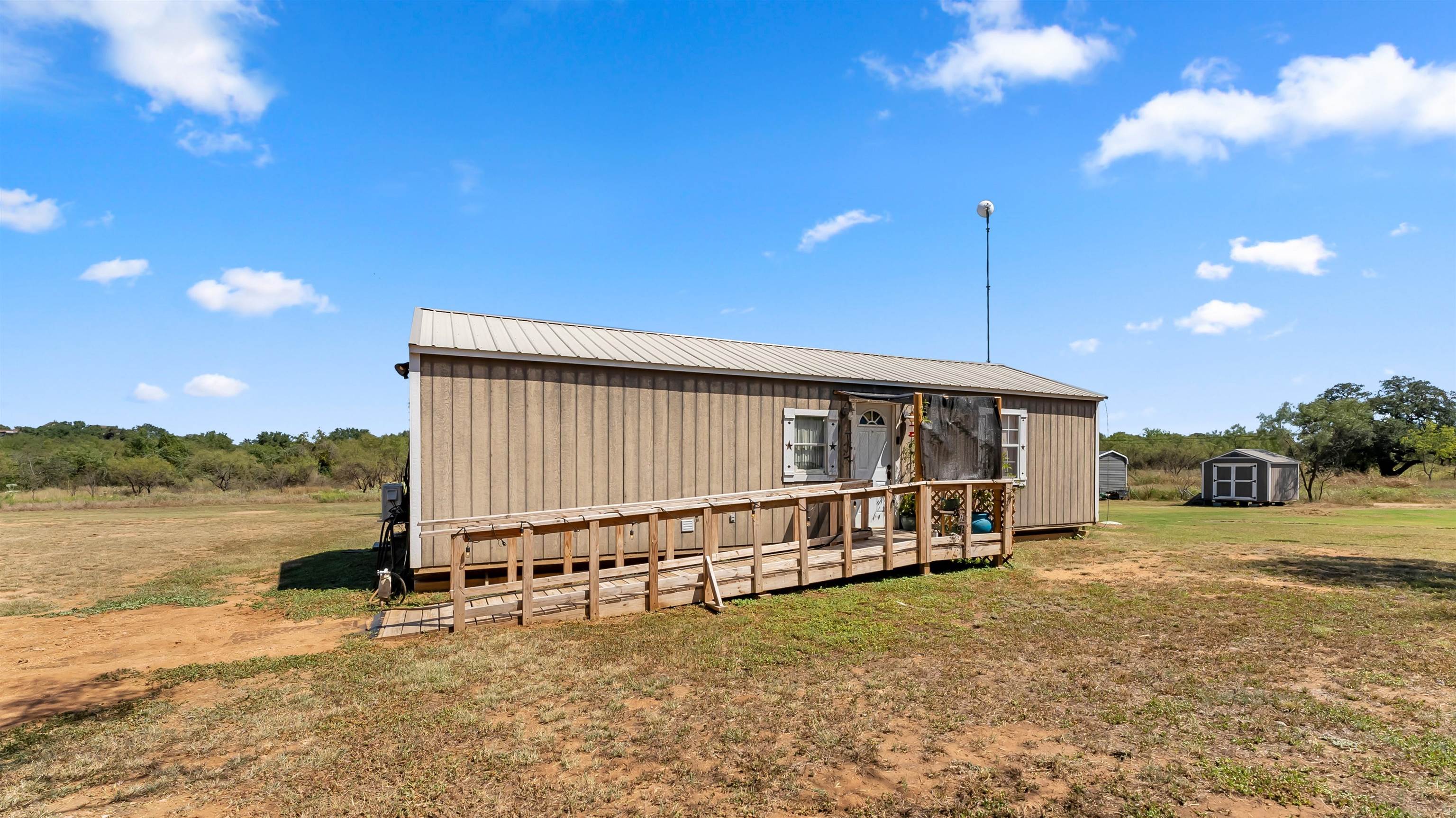 321 Flag Creek Ranch Circle Llano, TX 78643 - Photo 24 of 30 a view of a house with a yard and sitting area