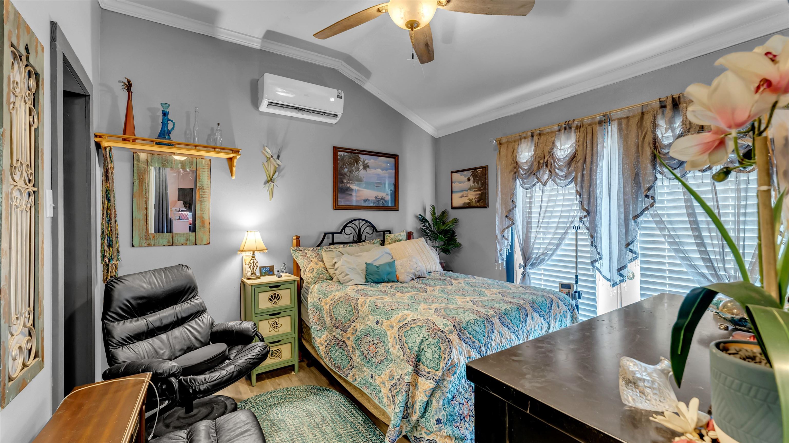 321 Flag Creek Ranch Circle Llano, TX 78643 - Photo 27 of 30 a bedroom with furniture and a large window