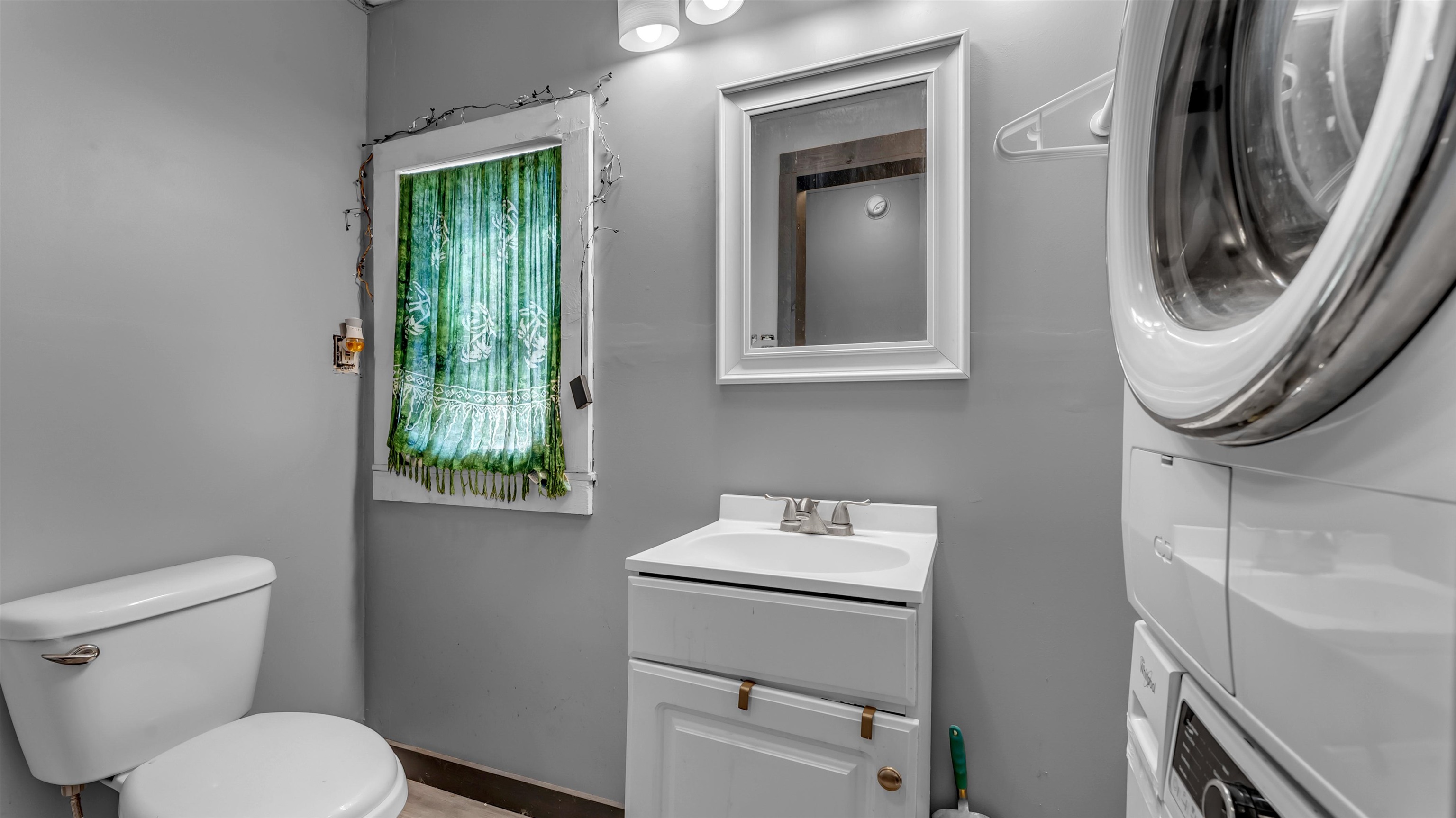 321 Flag Creek Ranch Circle Llano, TX 78643 - Photo 28 of 30 a bathroom with a toilet sink and mirror