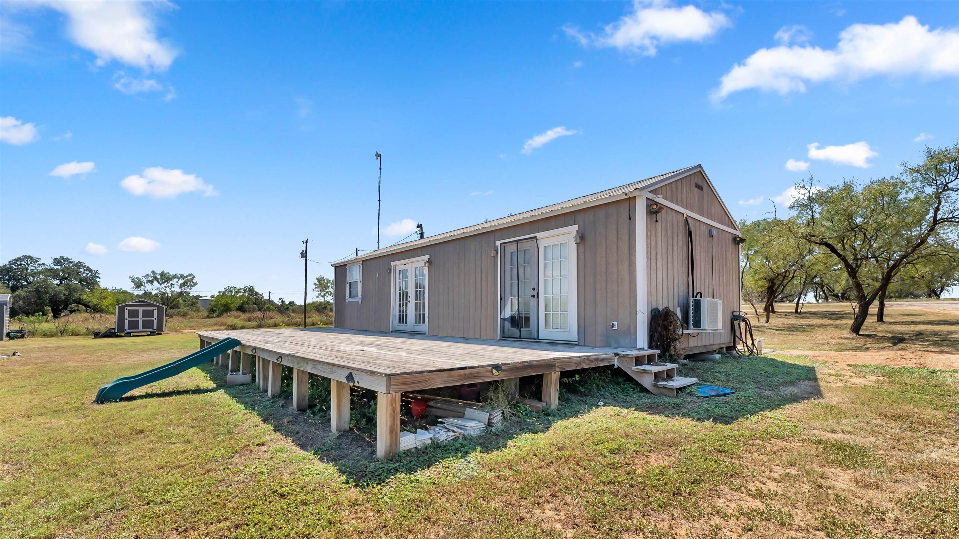 321 Flag Creek Ranch Circle Llano, TX 78643 - Photo 29 of 30 a view of a house with swimming pool