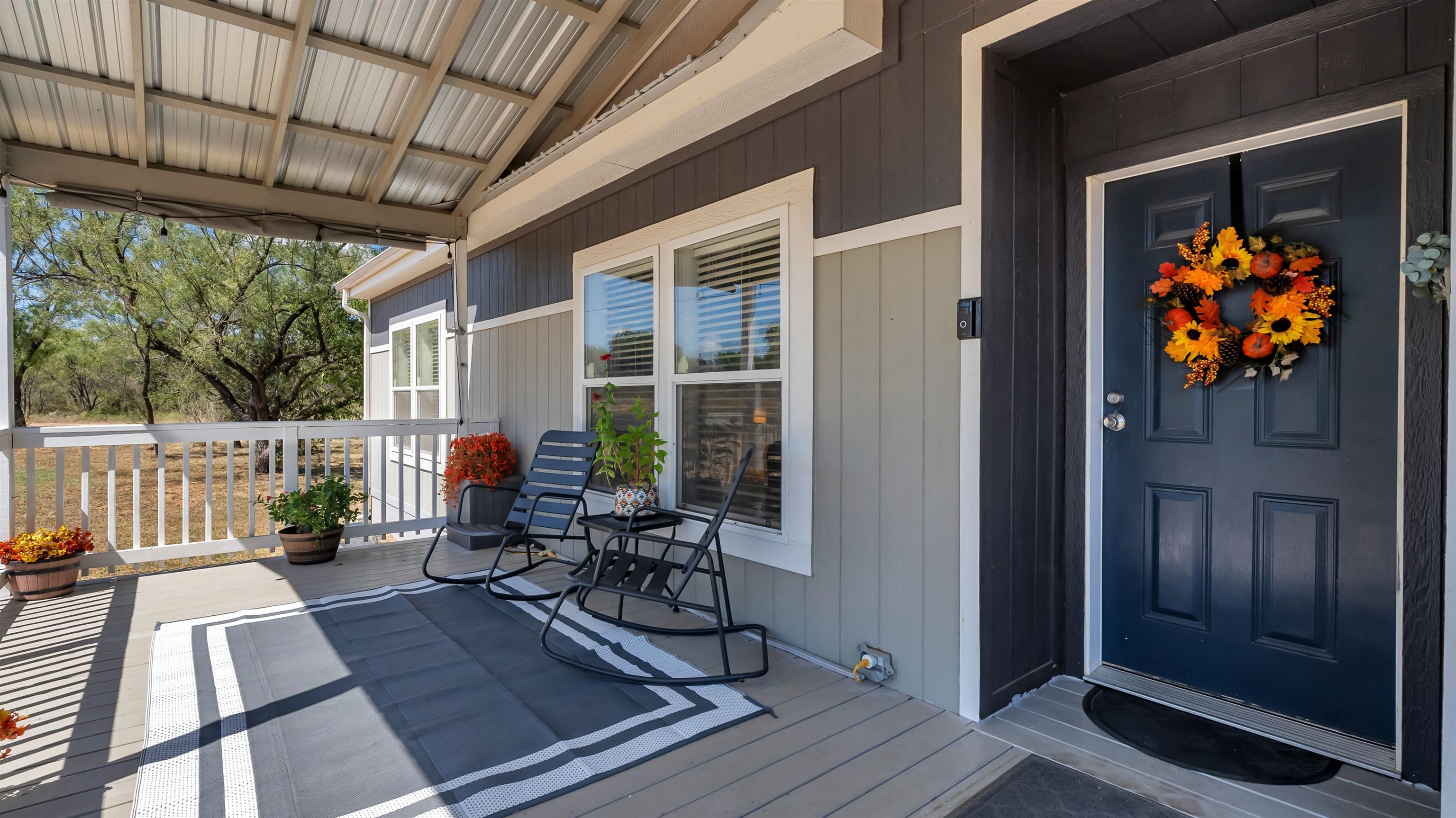 321 Flag Creek Ranch Circle Llano, TX 78643 - Photo 4 of 30 a view of balcony with furniture and wooden floor