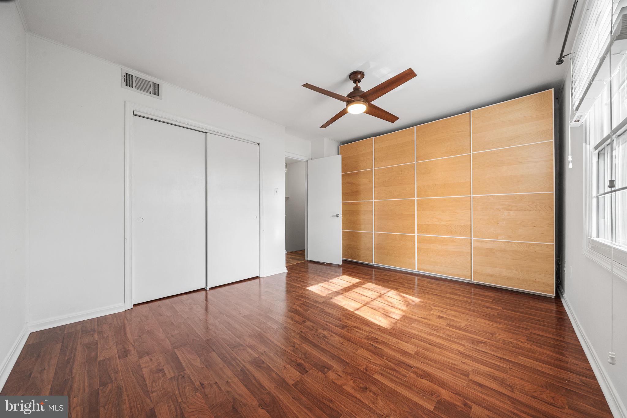 5845 Rexford Drive, Unit 721 Springfield, VA 22152 - Photo 16 of 32 a view of empty room with wooden floor and fan