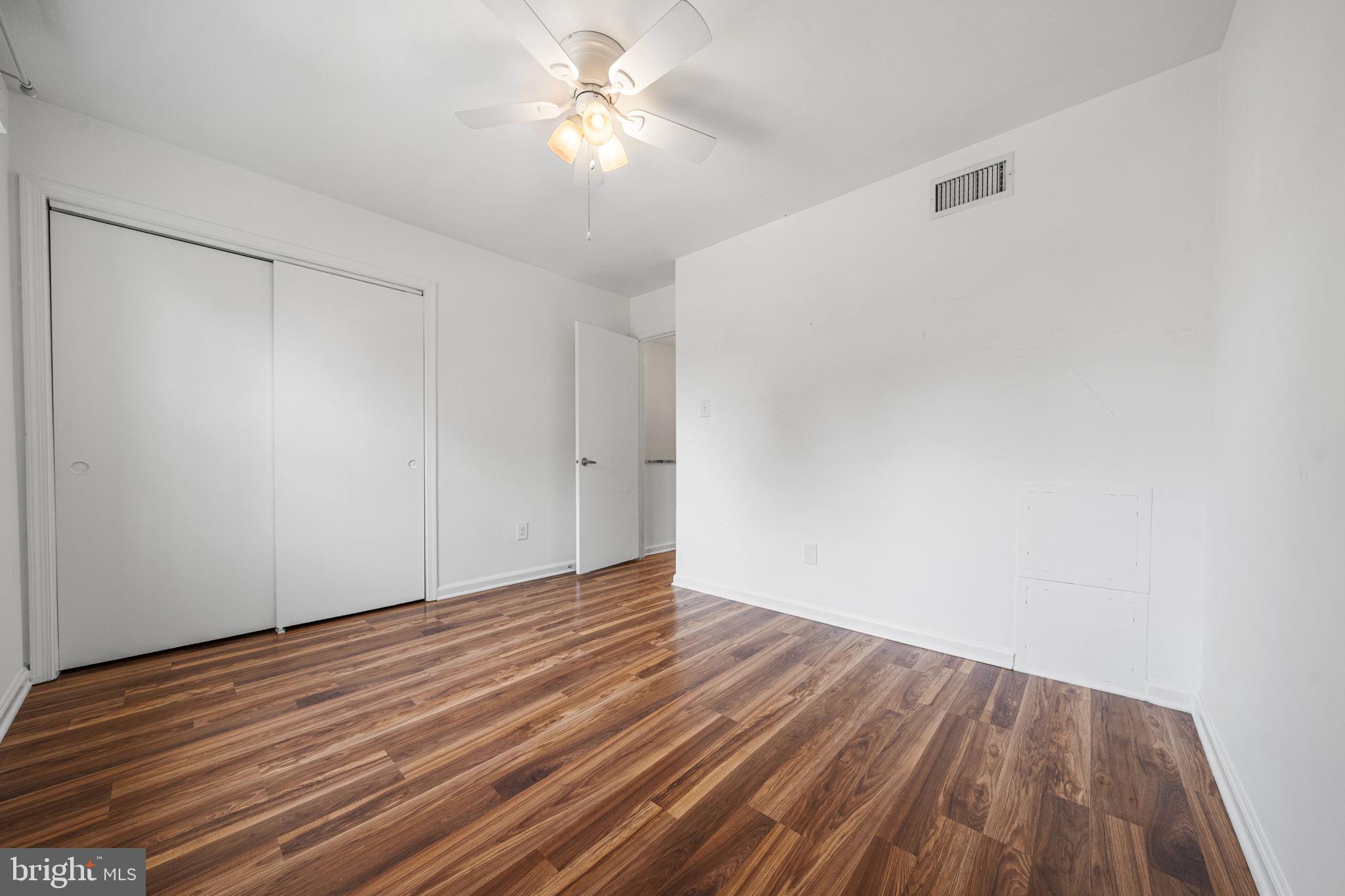 5845 Rexford Drive, Unit 721 Springfield, VA 22152 - Photo 20 of 32 wooden floor in an empty room