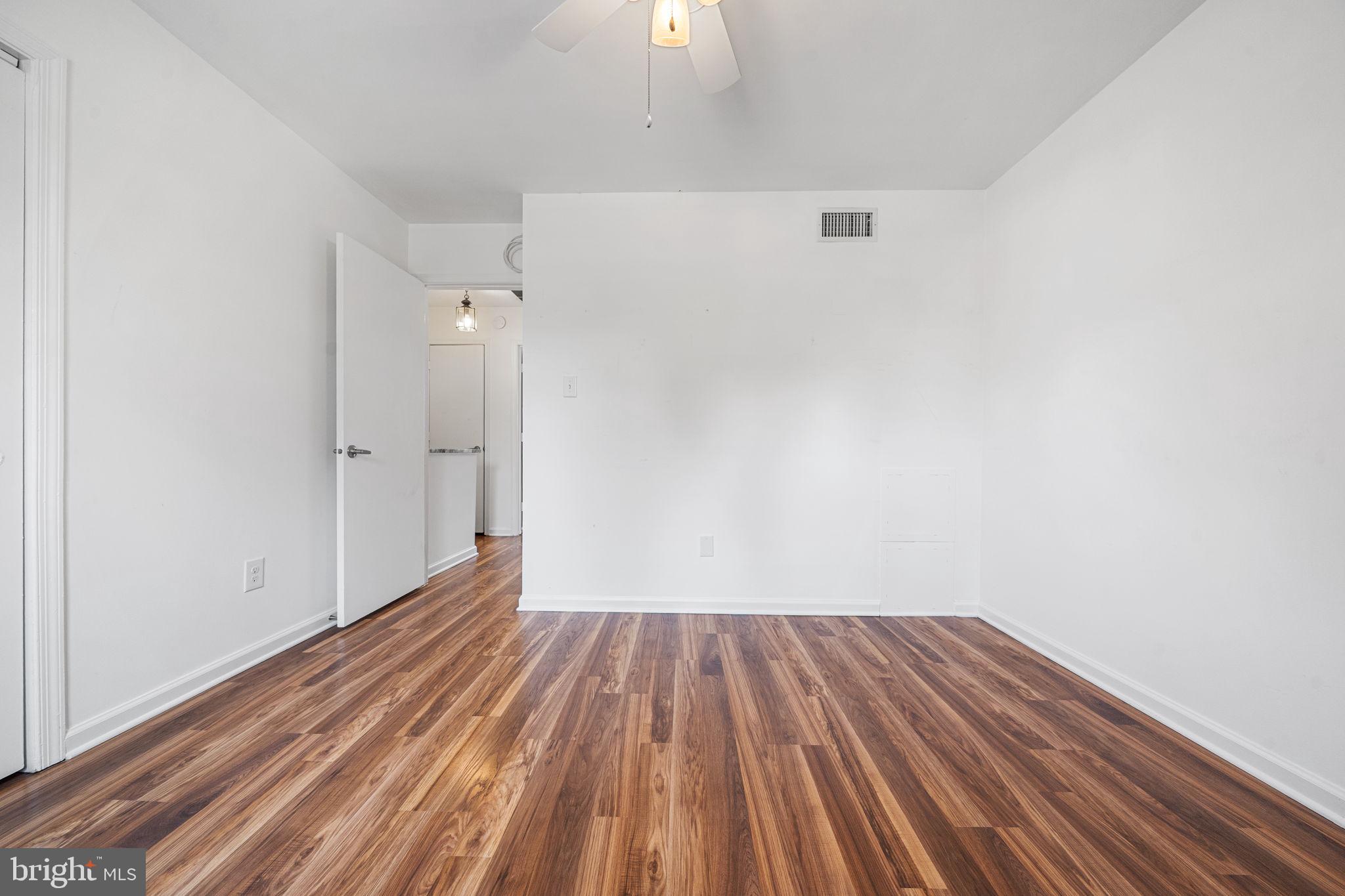 5845 Rexford Drive, Unit 721 Springfield, VA 22152 - Photo 22 of 32 a view of a room with wooden floor and a sink