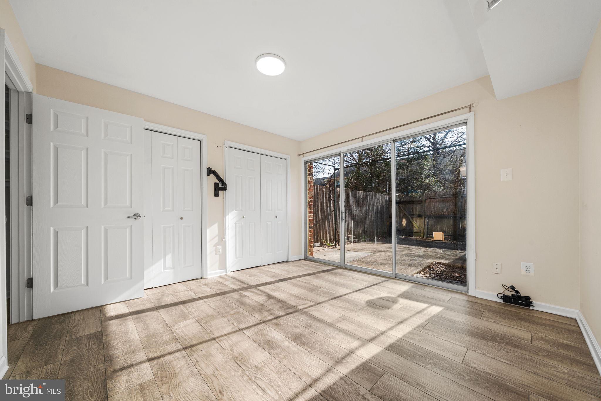 5845 Rexford Drive, Unit 721 Springfield, VA 22152 - Photo 25 of 32 a view of a room with wooden floor and a rug