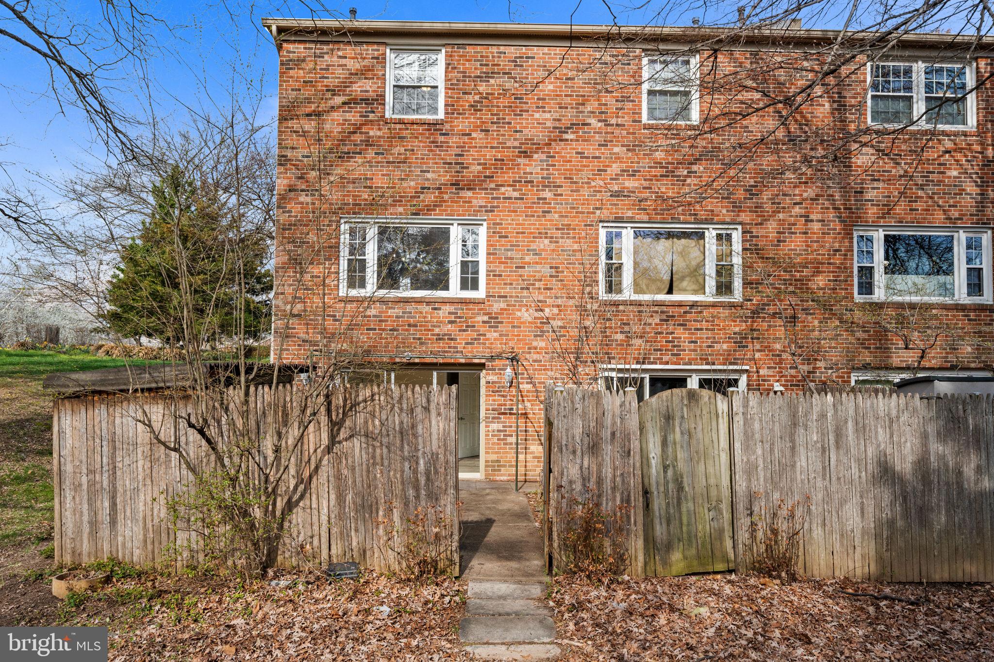 5845 Rexford Drive, Unit 721 Springfield, VA 22152 - Photo 30 of 32 a brick building with a lake view