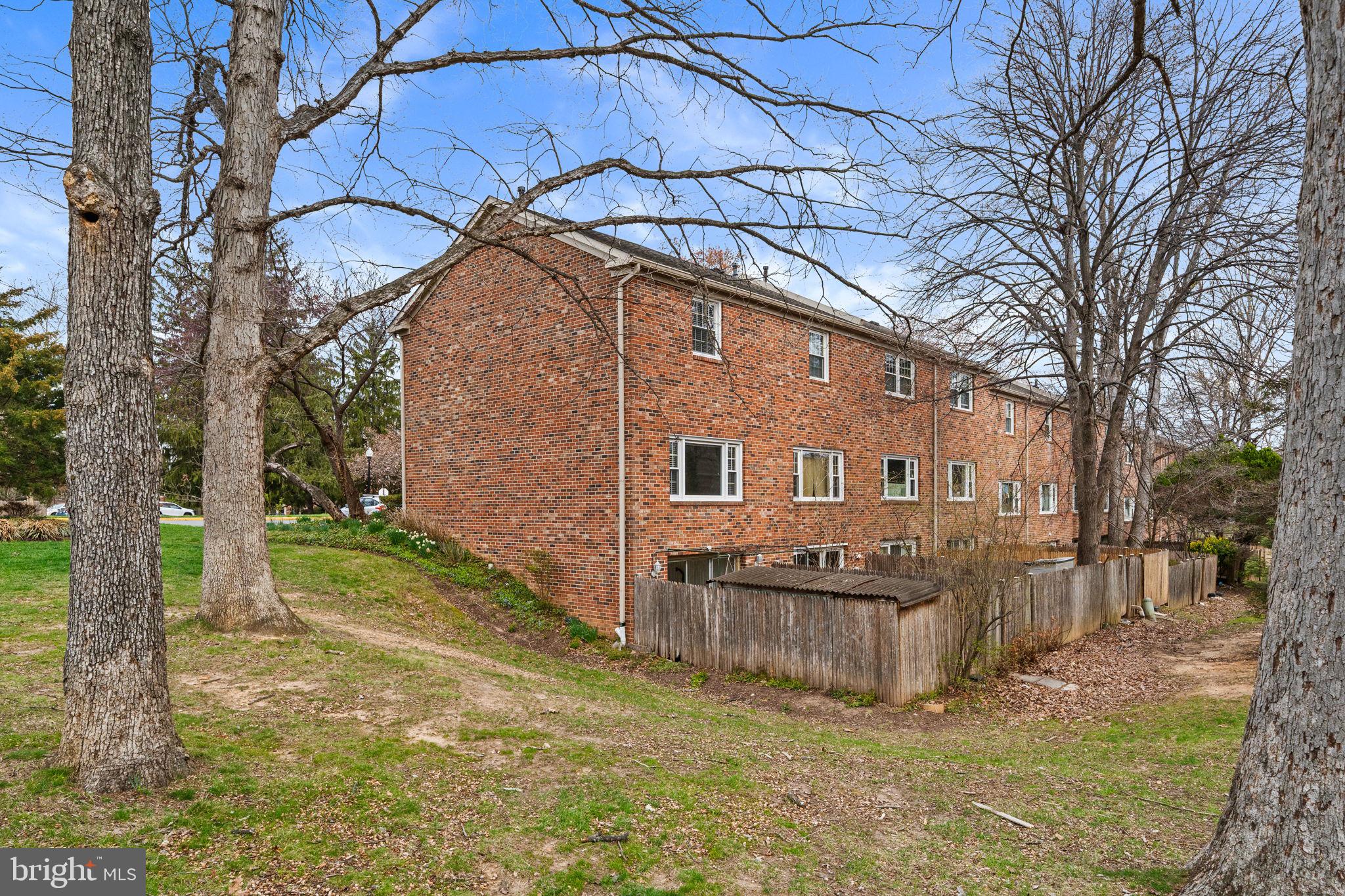 5845 Rexford Drive, Unit 721 Springfield, VA 22152 - Photo 31 of 32 a view of a house with a yard