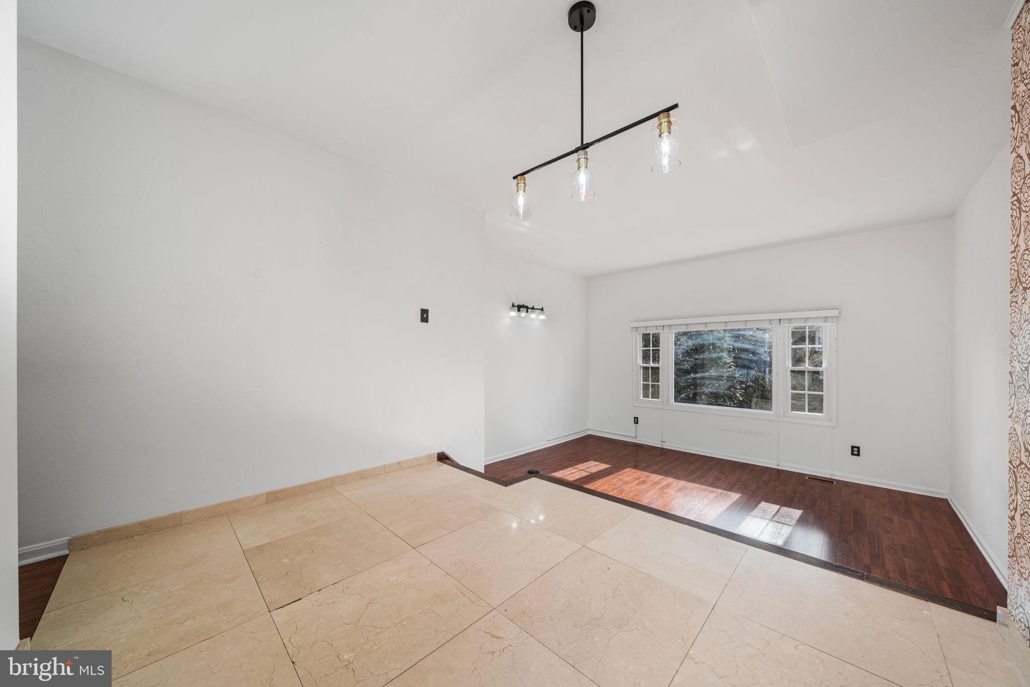 5845 Rexford Drive, Unit 721 Springfield, VA 22152 - Photo 5 of 32 a view of an empty room with a window