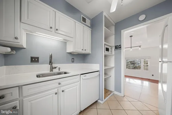 a kitchen with cabinets and appliances