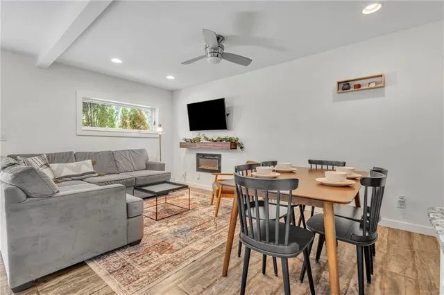 a view of a livingroom with furniture and a flat screen tv