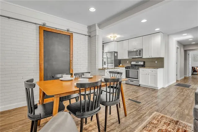 a view of a dining room with furniture