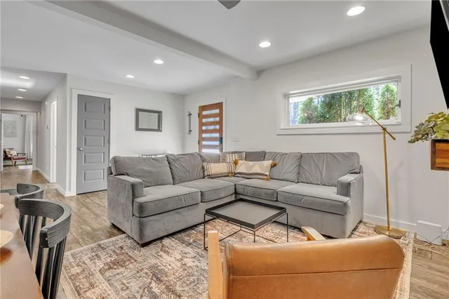 a living room with furniture and a large window