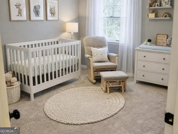 a bedroom with furniture and a window