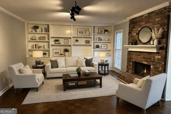 a living room with furniture a rug and a fireplace
