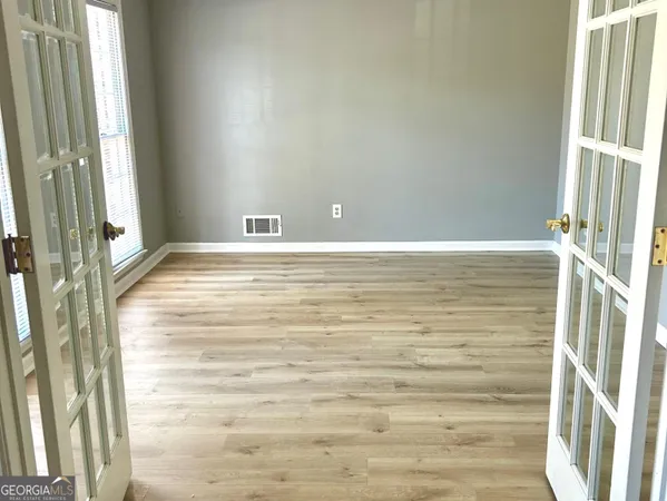 a view of an empty room and window