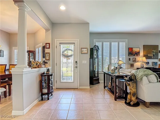 a view of kitchen with windows cabinets and refrigerator