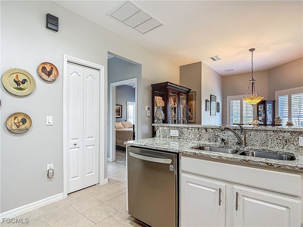 3630 Rue Alec Loop, Unit 1 North Fort Myers, FL 33917 - Photo 17 of 50 a bathroom with a sink and a mirror