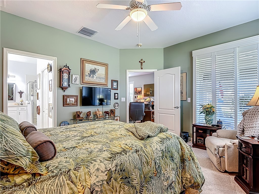 3630 Rue Alec Loop, Unit 1 North Fort Myers, FL 33917 - Photo 21 of 50 a bedroom with a bed and furniture