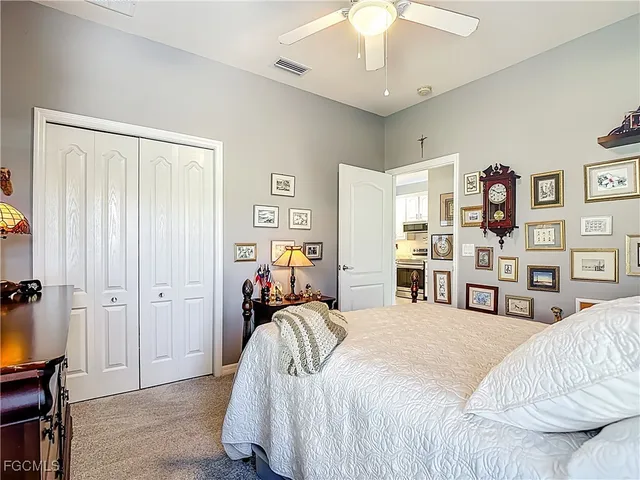 a bedroom with a bed and a walk in closet